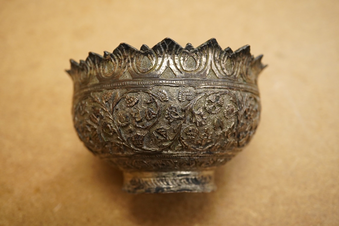 A 19th century Kashmiri base metal repousse bowl , with foliate border, diameter 10.8cm.